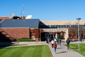 View of the Park School of Communications, students walking towards the front entrance