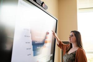 Student points to a chart on a screen 