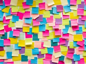 multi colored post it notes on a wall