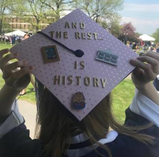 Decorated graduation cap with the slogan "And the rest is history"