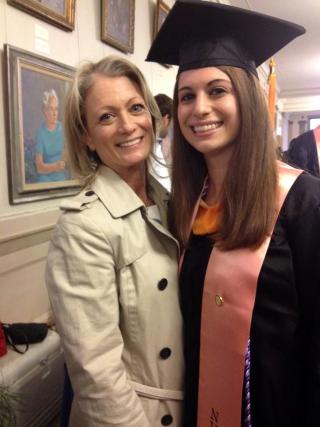 woman in graduation gown and mortarboard with mom