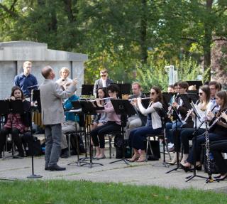 group of instrumentalists playing in the park