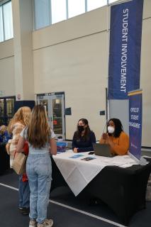 Students visiting a booth