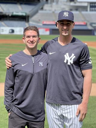 Joe Bello ‘15, DPT ‘17 and Tim Locastro ‘14 standing at Yankee Stadium