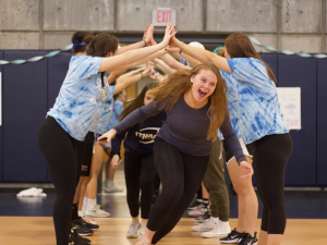 Student runs through arches