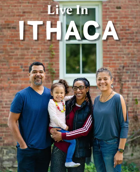 Family in front of a brick house