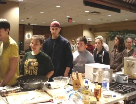 Students serve food they prepared in the nutrition club.