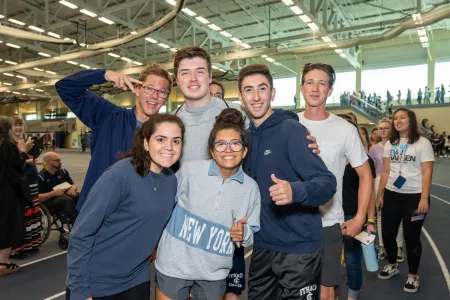 Young people standing and smiling