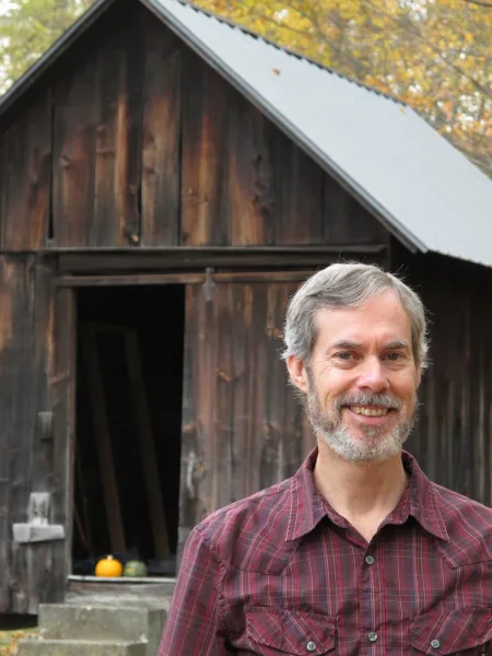 Man standing in front of old building