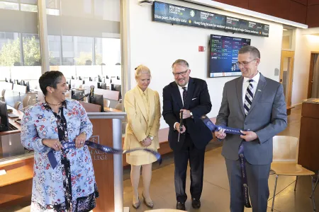 people cutting a ribbon in a dedication ceremony