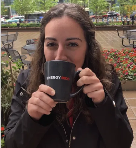 A young woman drinking from a mug