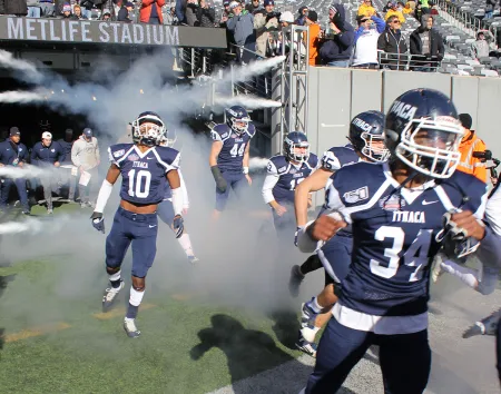 Football players run out onto the field