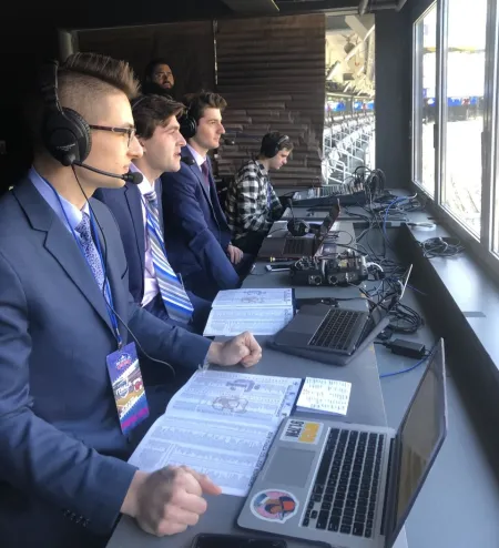 IC's radio-television students sit in a pressbox 