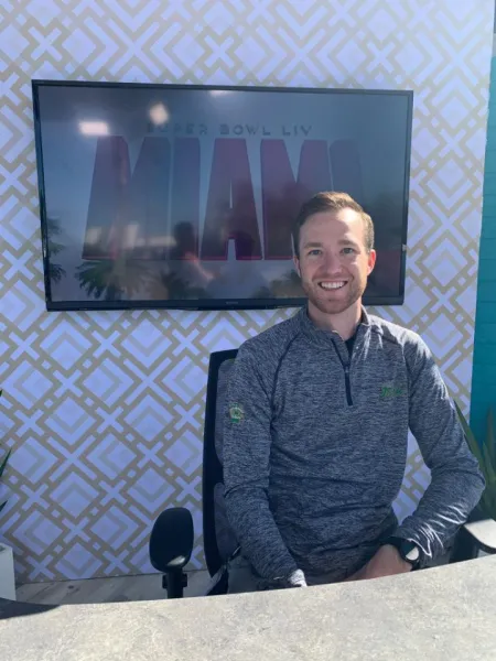 man in front of screen at Super Bowl