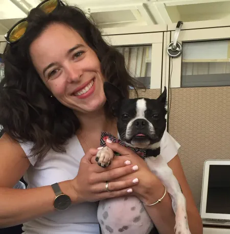 young woman with small black and white dog