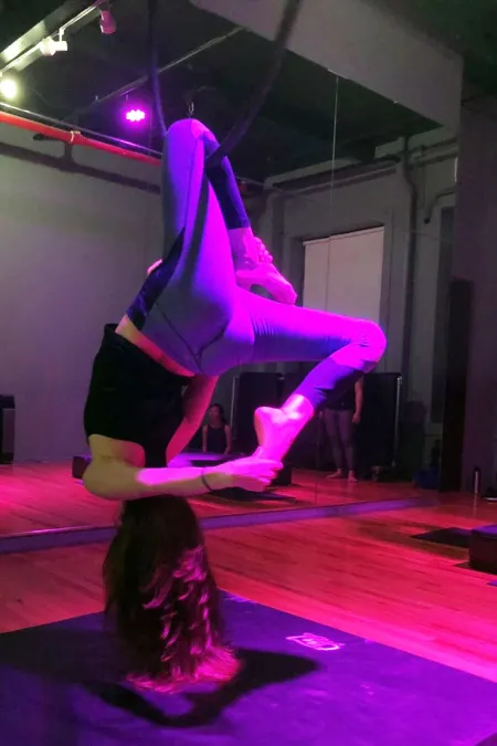 woman hanging from hoop