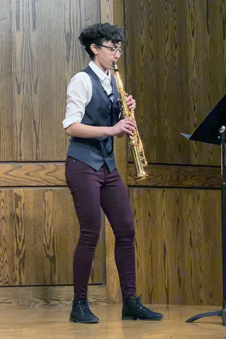 woman playing saxophone