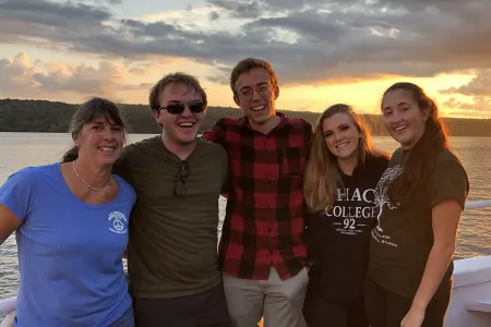 professor and students on boat