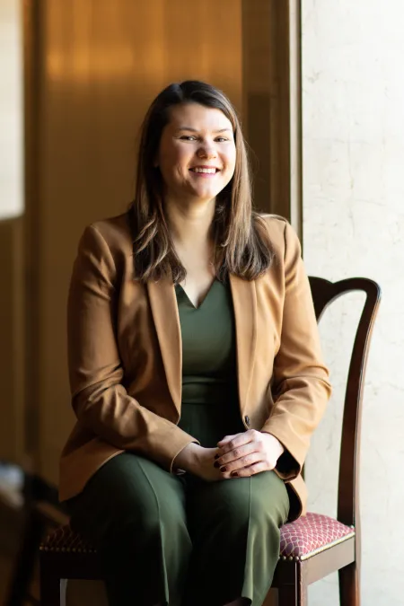 Person sitting in chair smiling