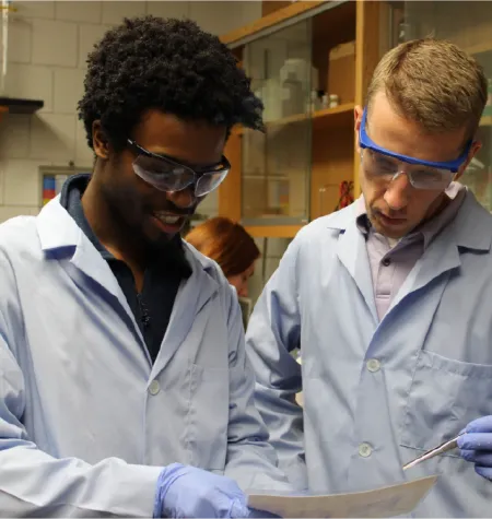 Darnell Harris discussing his gel results in the Torelli Lab