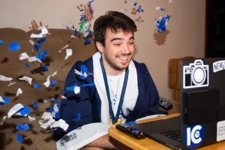 student celebrating.