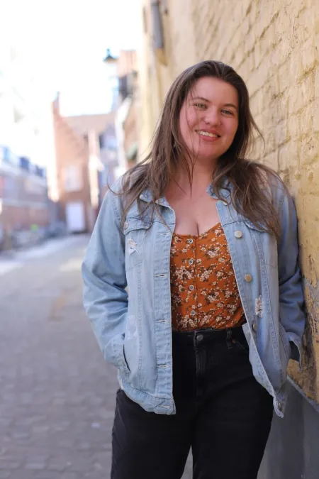 Headshot of young woman with long brown hair