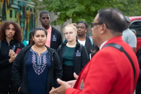 A tour guide explains the Bloody Selma march to a group of MLK Scholars