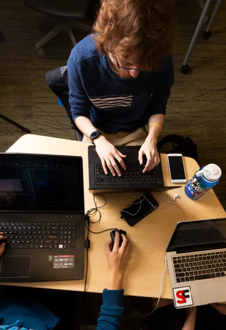 Two students working on computers