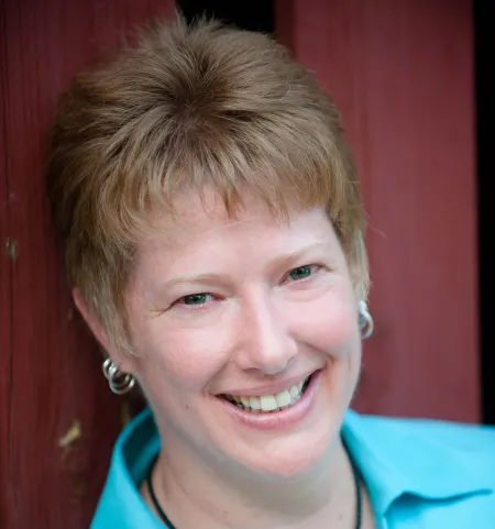 smiling Caucasian woman with short reddish hair