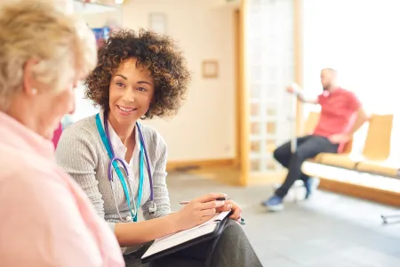 Dr. with patient in waiting room  