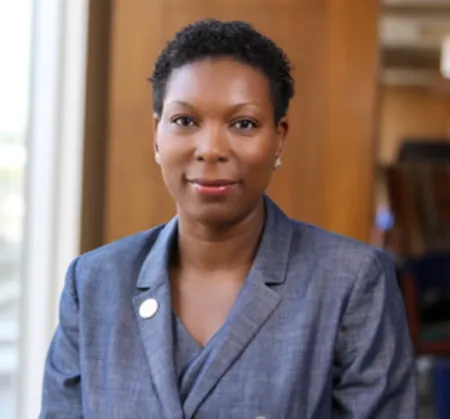 Image of an African American woman wearing a blue blazer
