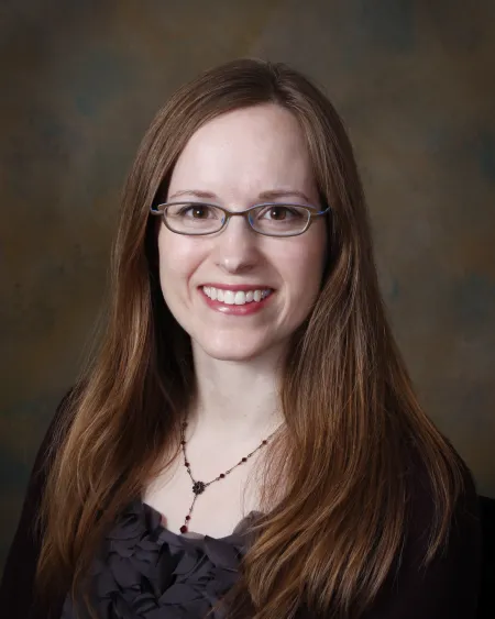 Woman smiling wearing glasses