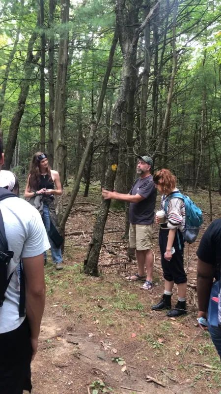 Students standing outside in a circle in the IC natural lands
