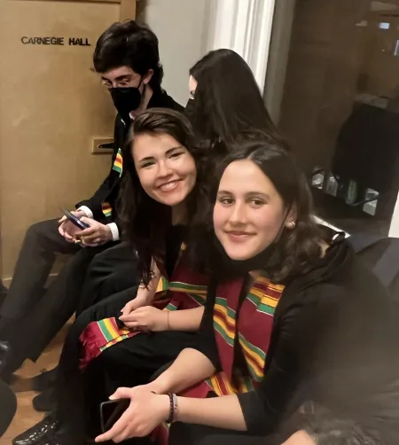 Students sitting backstage