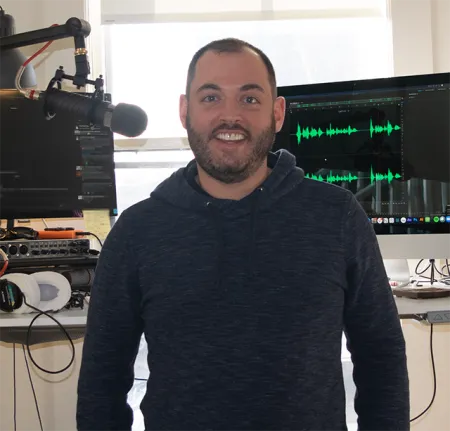 Jeff Umbro standing in front of equipment