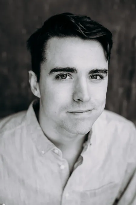 Man smiling in black and white picture