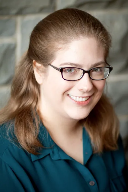 Woman in glasses smiling