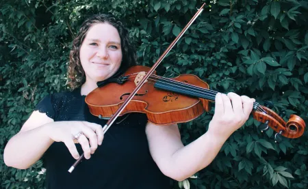 Woman smiling playing the viola
