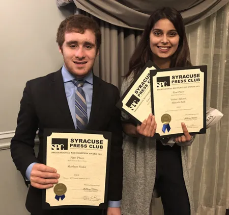 Matthew Sosler ’23 and Himadri Seth ’23 holding awards.