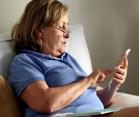 woman looking at smart phone