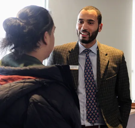Jhonny Perez talking with a student