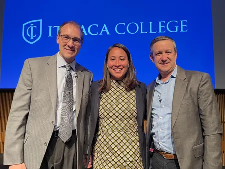The three panelists standing together