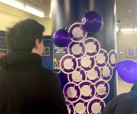 Student looking at stickers