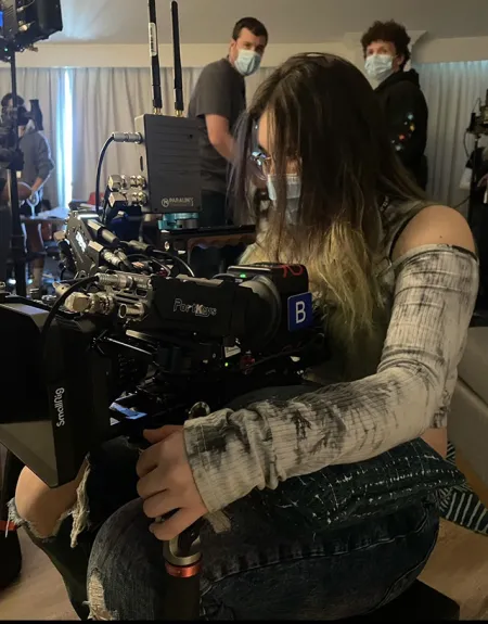 Alex Isbell at a camera