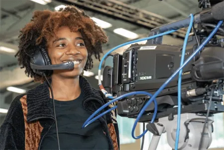 Student behind a camera