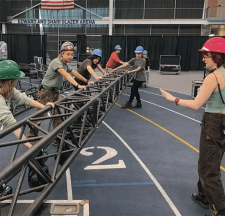 Student leading group of workers