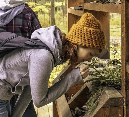 Student smelling herbs