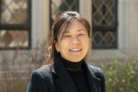 Lydia Tuan in front of a stone building