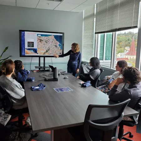 Students looking at a presentation at Ursa Systems