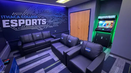 Comfortable seating and gaming consoles in the IC Esports lounge